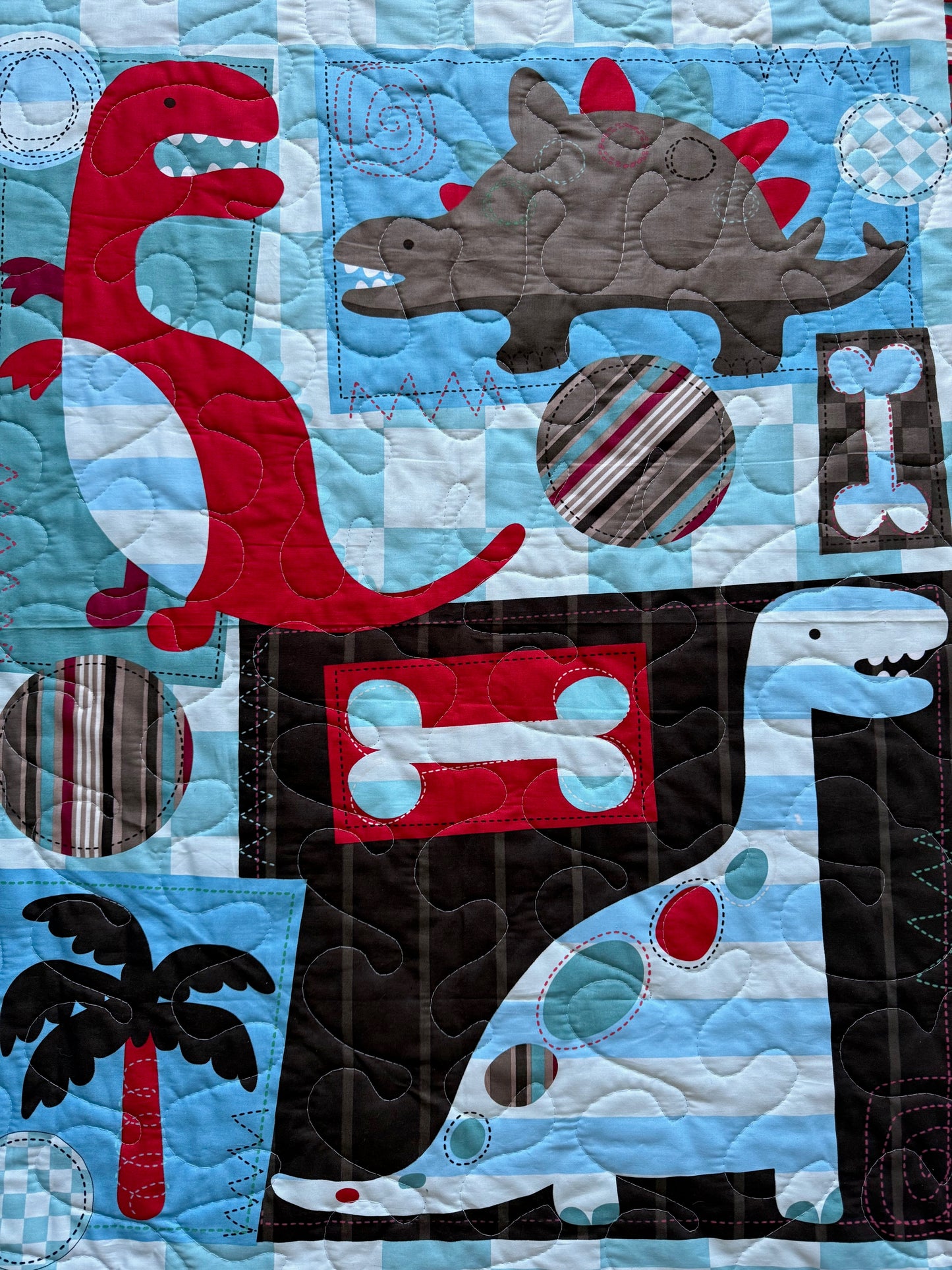 Variety of Dinosaurs Red, Brown, Blue Quilted Blanket