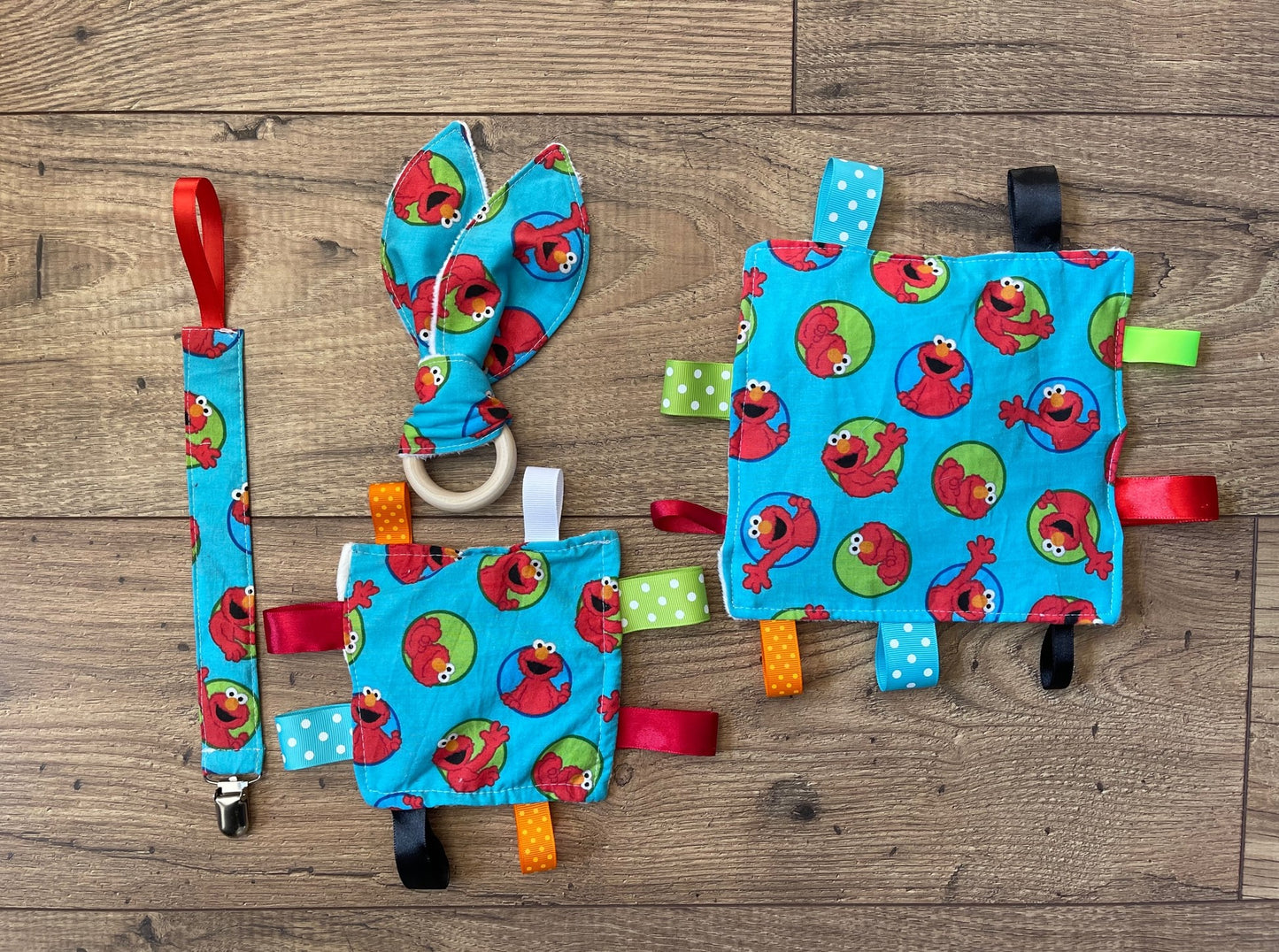 ELMO Baby Sensory Crinkle Toy with Ribbons, Pacifier Clip & Teether