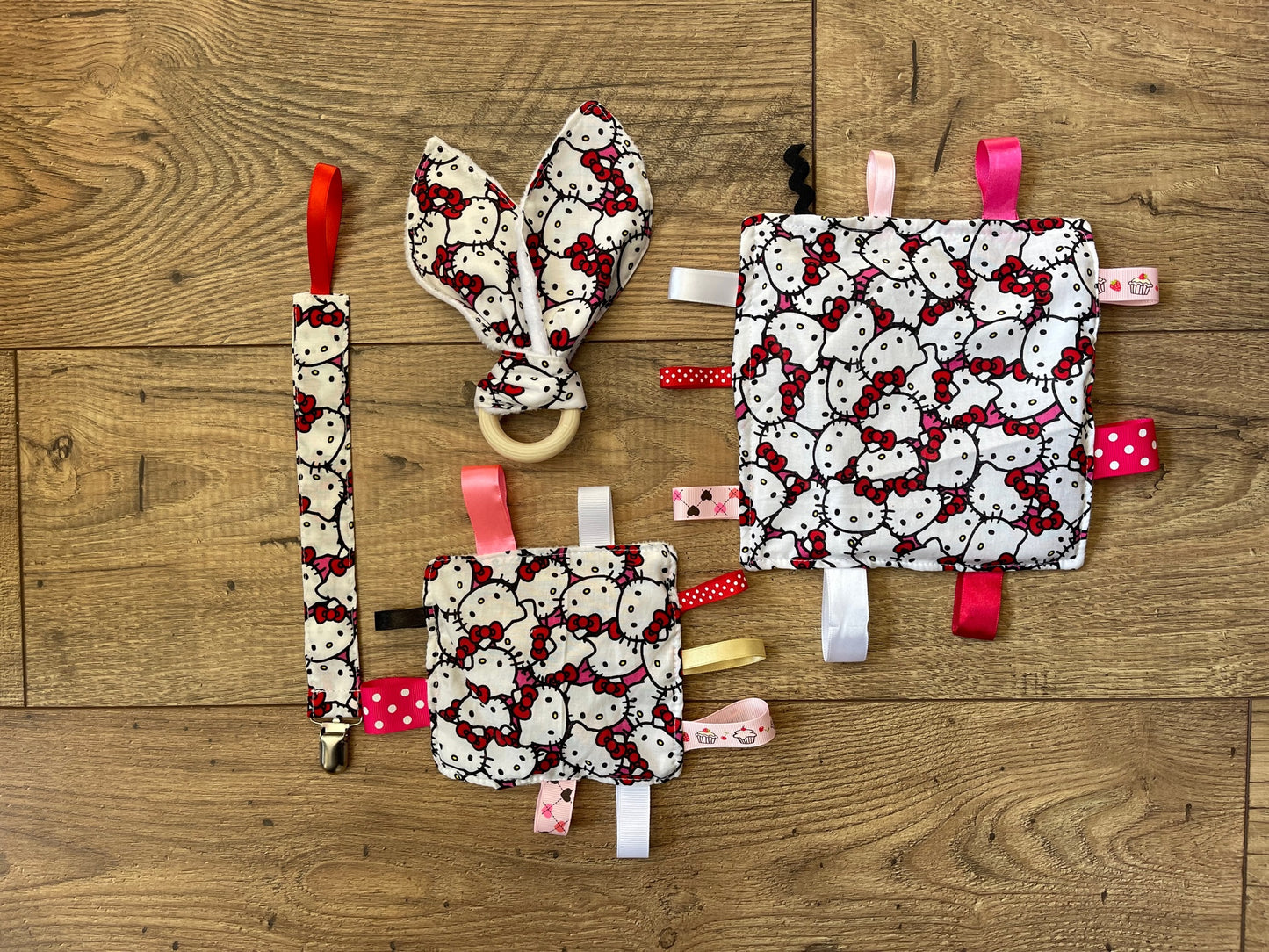 KITTY Baby Sensory Crinkle Toy with Ribbons, Pacifier Clip & Teether