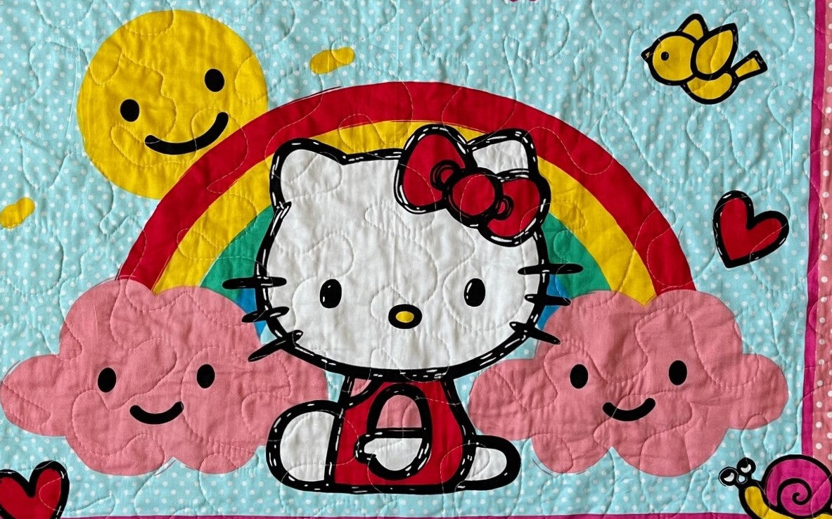 KITTY RAIN OR SHINE RAINBOW QUILTED BLANKET