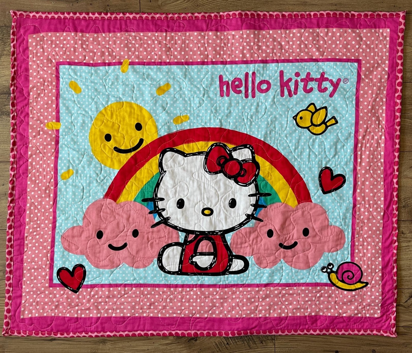 HELLO KITTY RAIN OR SHINE RAINBOW QUILTED BLANKET