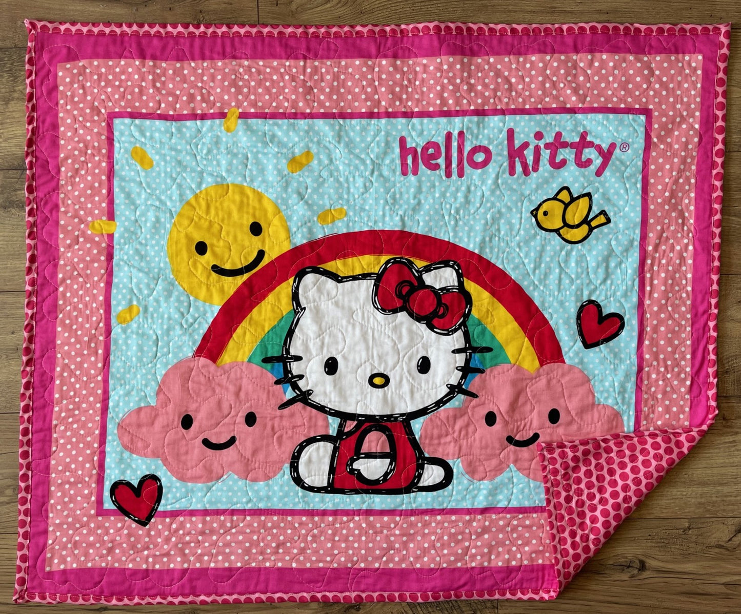 KITTY RAIN OR SHINE RAINBOW QUILTED BLANKET