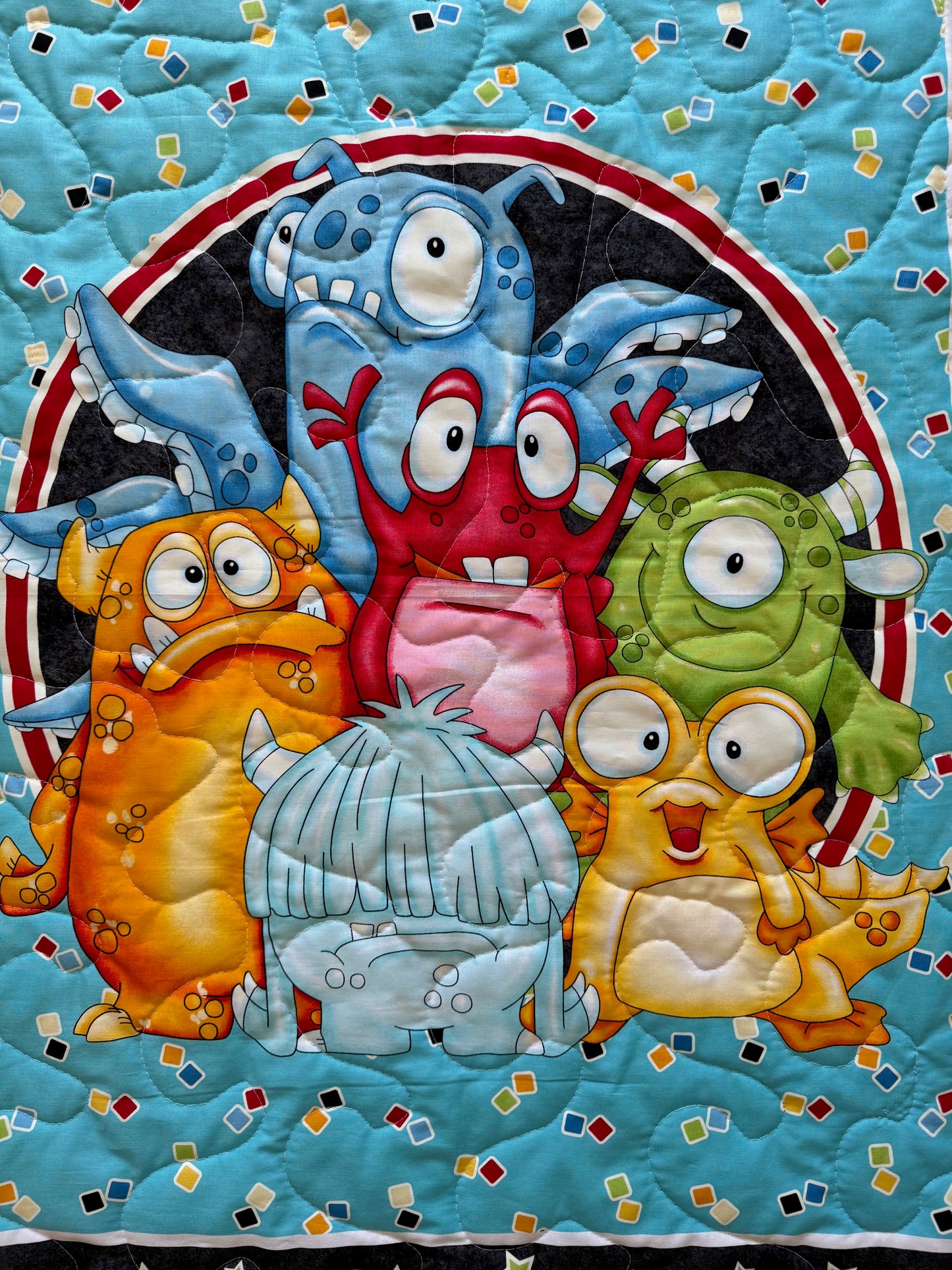 GOOGLY EYED MONSTERS QUILTED BLANKET