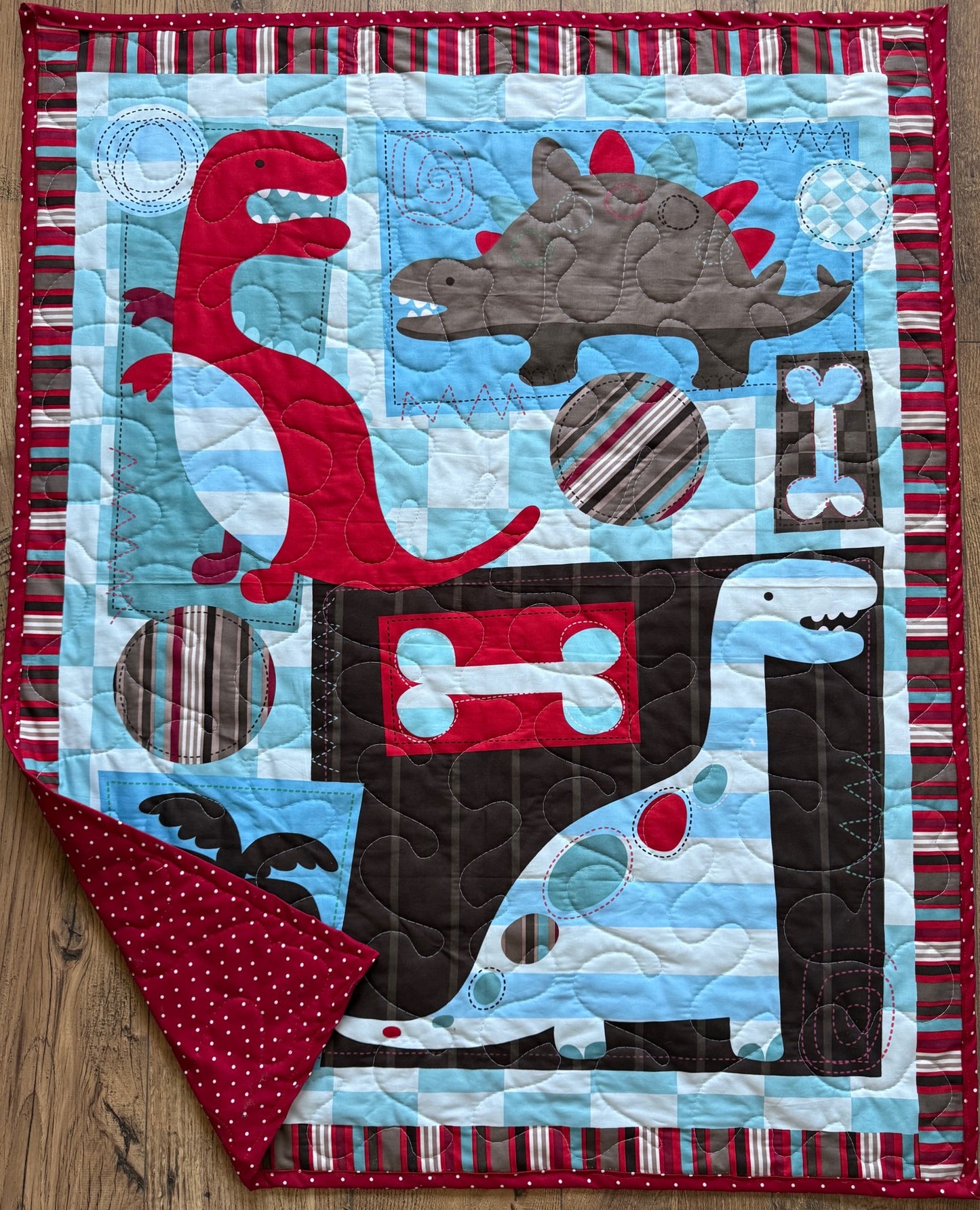 Variety of Dinosaurs Red, Brown, Blue Quilted Blanket