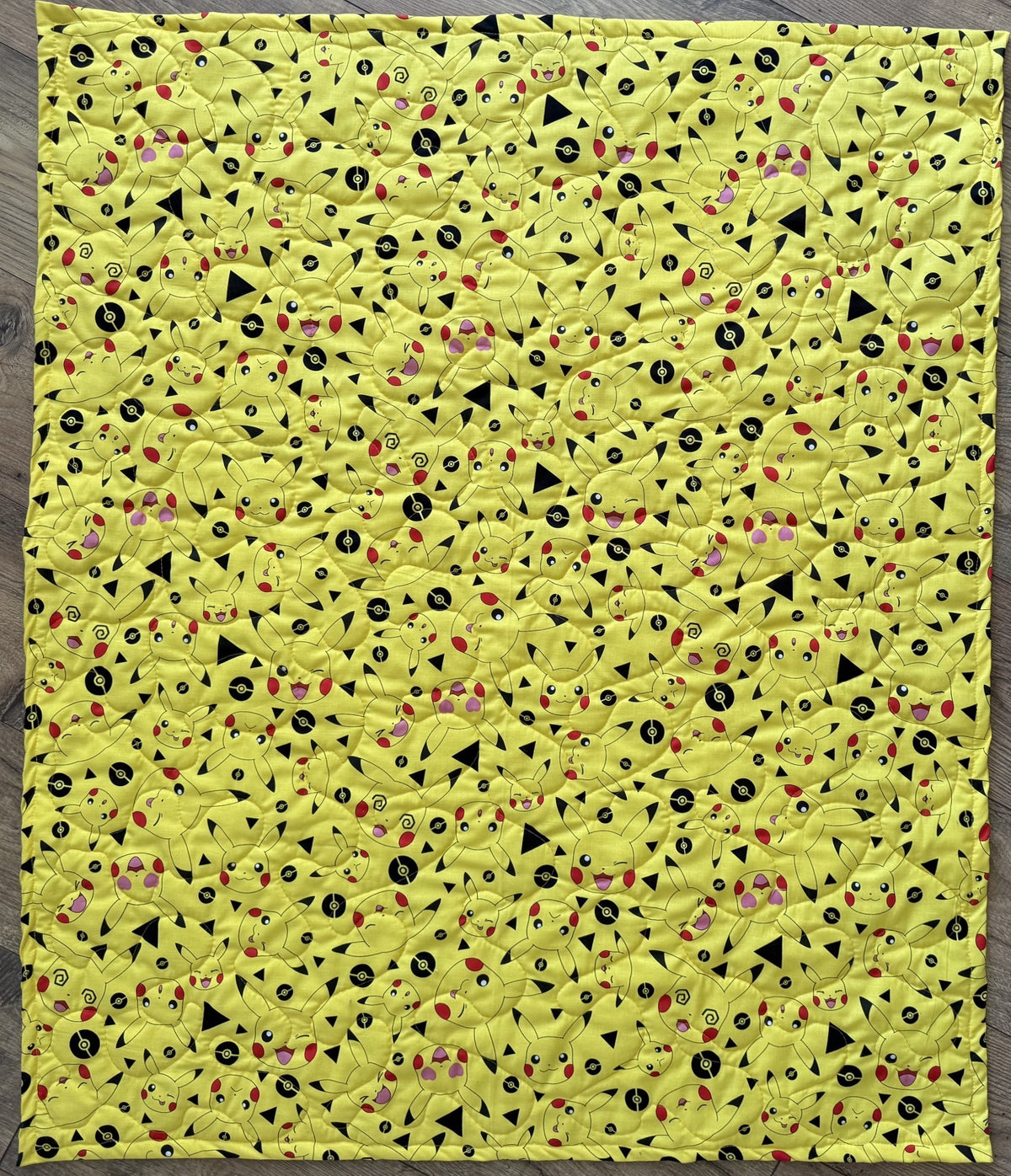 MANY FACES OF PIKACHU VIDEO GAME REVERSIBLE QUILTED BLANKET