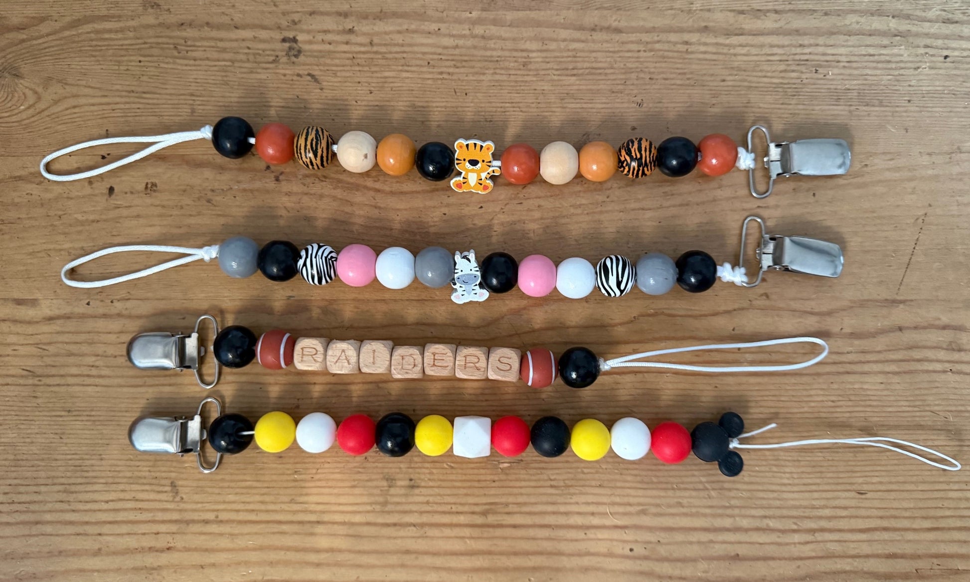 SALE TIGER, ZEBRA, RAIDERS FOOTBALL, MICKEY MOUSE Wood Beaded Pacifier Clips Teether Toy Leash